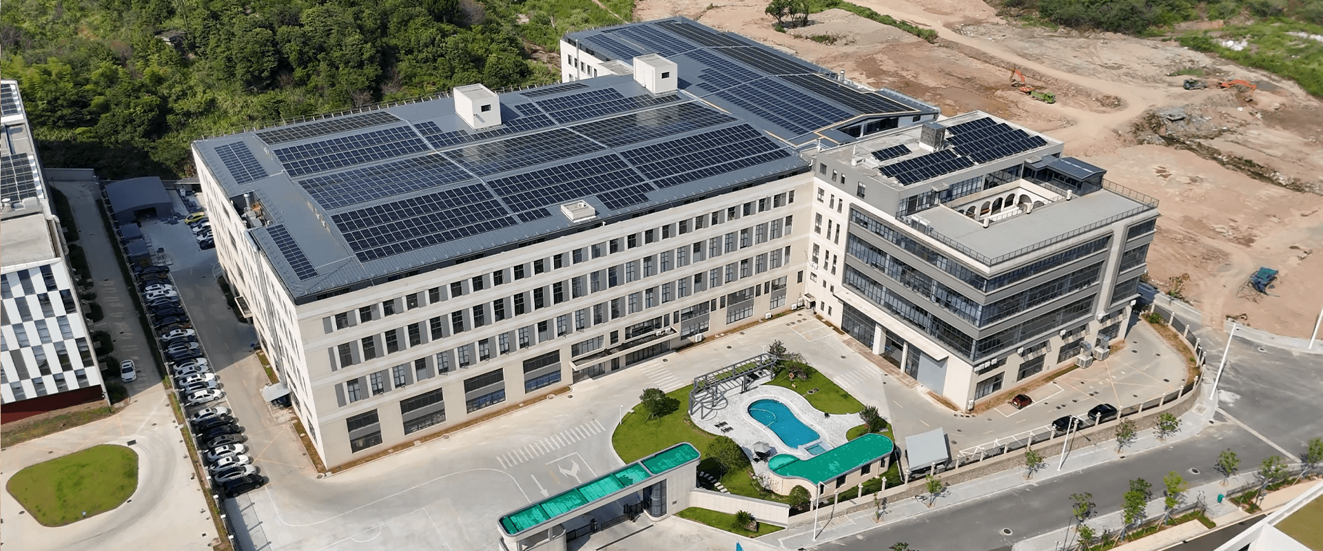 Modern industrial complex with extensive solar panel installation